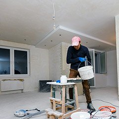 Team member pouring paint