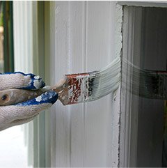 Person painting trim