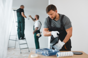a team of painters painting a home’s interior 