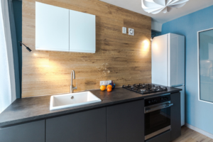 a minimalist kitchen with handleless cabinets